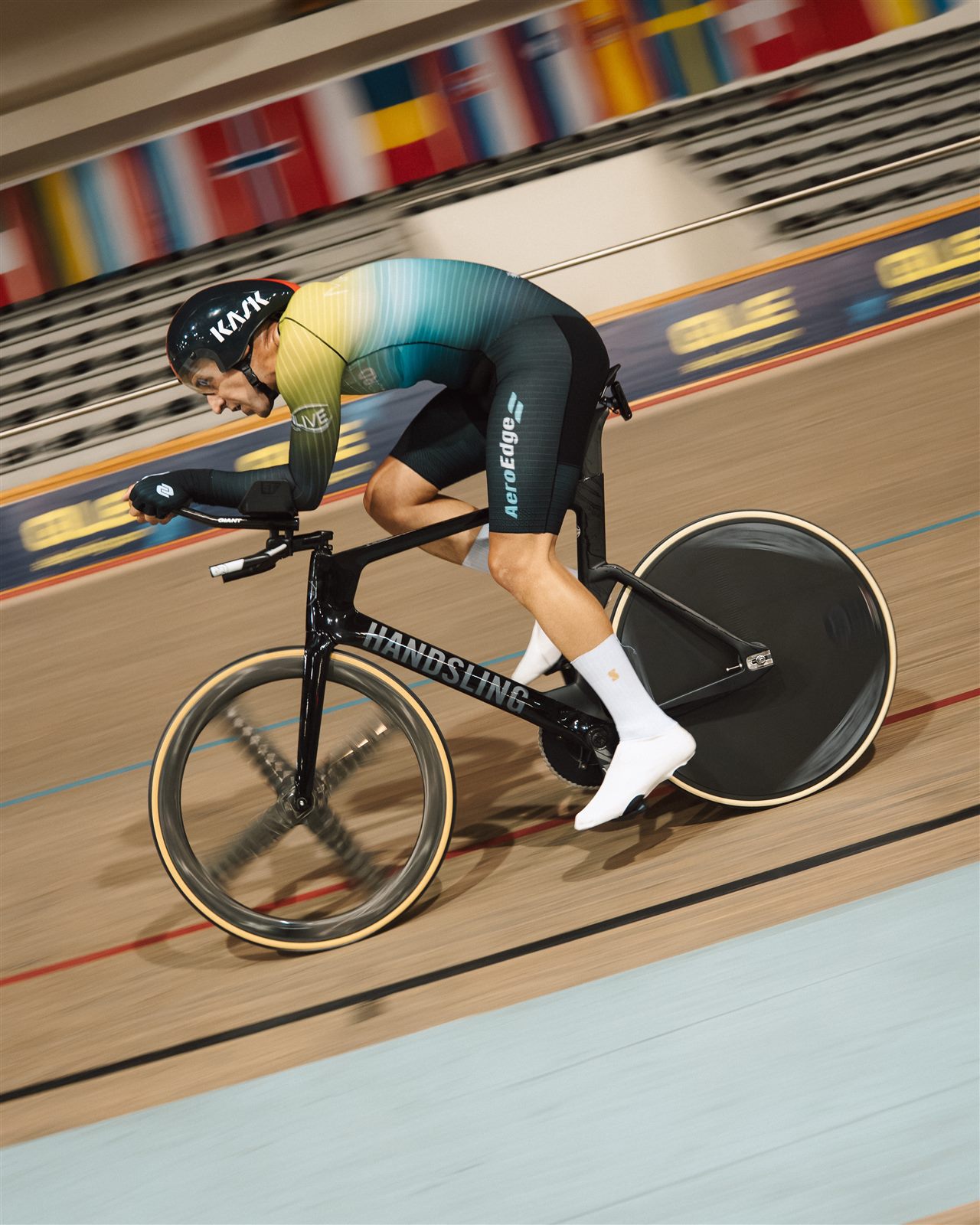 A rider passing the timing board during a velodrome test session